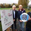 John Deery (centre) from Eglinton survived a cardiac arrest at this year’s Belfast Marathon thanks to a life-saving defibrillator and CPR performed by Peter O’Hare (right holding the defib,). John and Peter are pictured alongside Head of British Heart Foundation NI’s Fearghal McKinney.