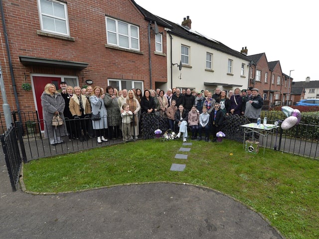 Family, neighbours and friends who attended the unveiling of a bench, in Culdaff Gardens, Creggan, in memory of Annette McDaid. Photo: George Sweeney