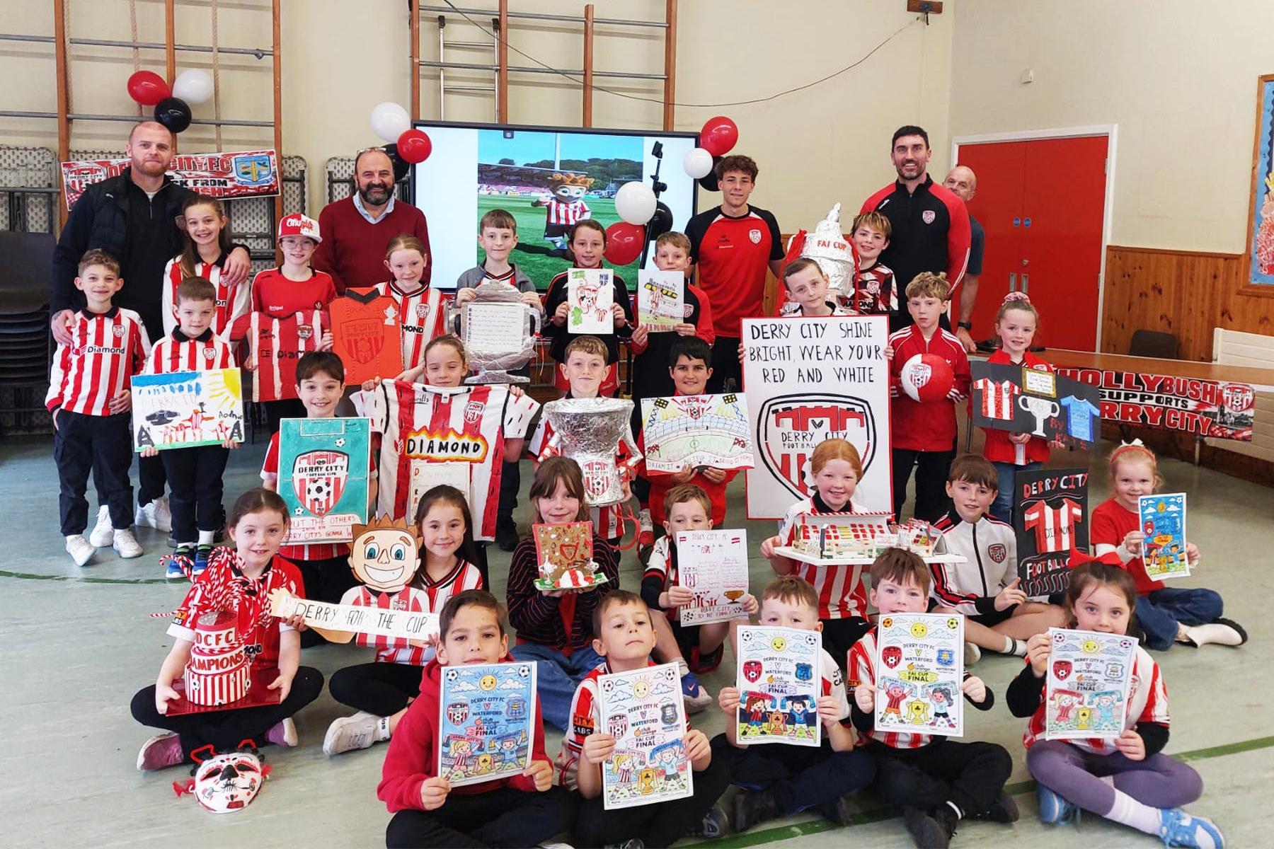 DERRY CITY VISIT. . . .Some of the art prizewinners pictured during Derry City's visit to Hollybush Primary School on Friday.