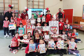 DERRY CITY VISIT. . . .Some of the art prizewinners pictured during Derry City's visit to Hollybush Primary School on Friday.
