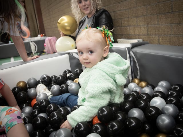 Maggie-May Donnelly (2) enjoying festivities on Saturday at Pilot's Row. : .