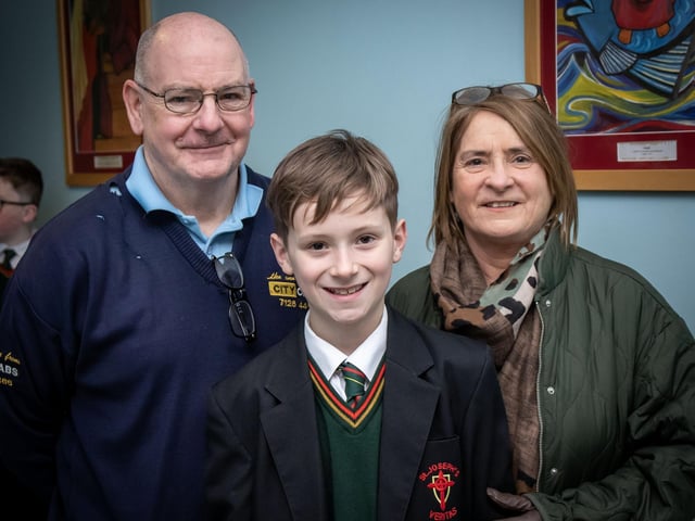 Grandparents John and Liz Gibson pictured with their grandson at St. Joseph's boys School on Wednesday. : .