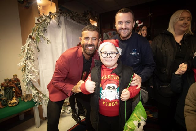 Micky Doherty pictured welcoming young Colly McDermott and his dad James on Thursday night.