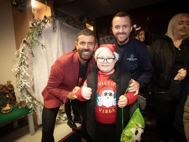 Micky Doherty pictured welcoming young Colly McDermott and his dad James on Thursday night.