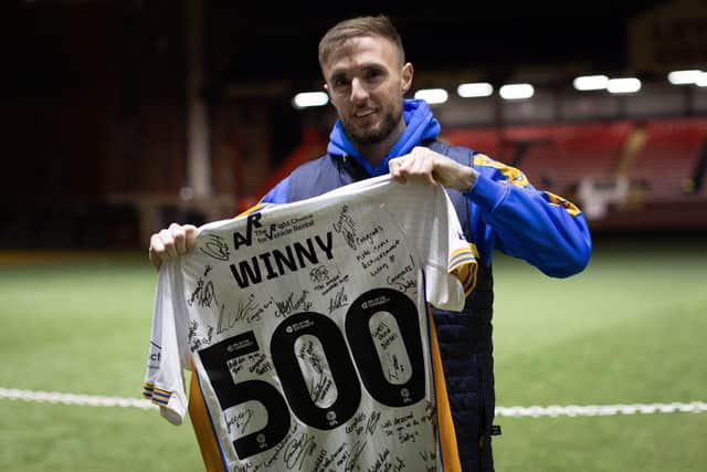 Carl Winchester, pictured celebrating his 500th appearance for Shrewsbury Town, is believed to be close to joining Derry City.