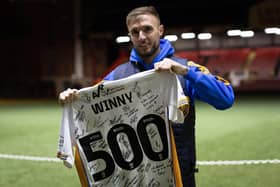 Carl Winchester, pictured celebrating his 500th appearance for Shrewsbury Town, is believed to be close to joining Derry City.