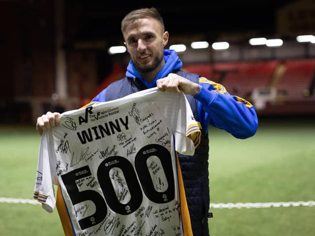 Carl Winchester, pictured celebrating his 500th appearance for Shrewsbury Town, is believed to be close to joining Derry City.