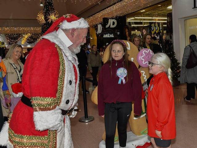 Santa arrives at the Richmond Shopping Centre on Sunday afternoon. Photo: George Sweeney