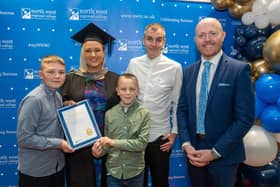 Andrena Moore pictured at her graduation from NWRC with husband William and sons Jensen and Dawson. They are pictured with Barra Best.