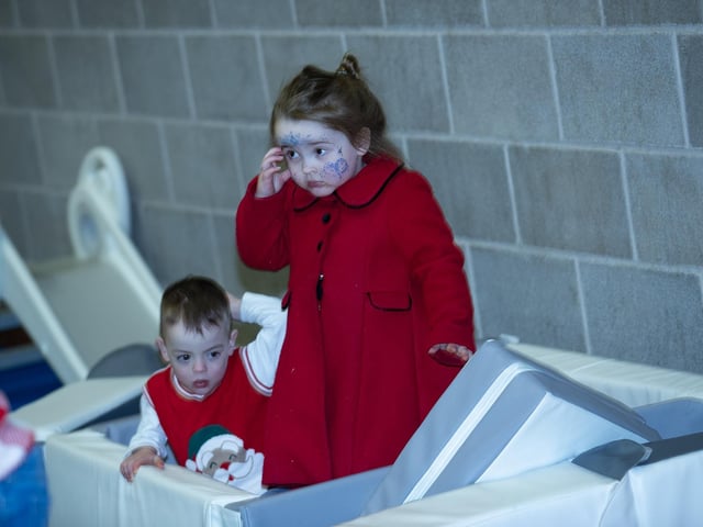 Fun and games for these toddlers at the 'Christmas Get Together' at the Long Tower Youth Club on Saturday last. : .