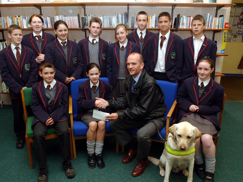 Year 9 students from Oakgrove Integrated College, presenting e cheque for £100 to John McNamee, Fighting Blindness, the proceeds of a series of raffles held at the school. (1605A31)