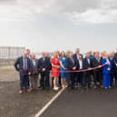 Charlie McConalogue Minister for agriculture, food and the marine cutting the red tape with DCC staff, elected representatives, contractors and Greencastle Harbour Staff