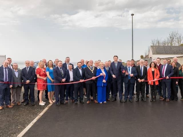Charlie McConalogue Minister for agriculture, food and the marine cutting the red tape with DCC staff, elected representatives, contractors and Greencastle Harbour Staff