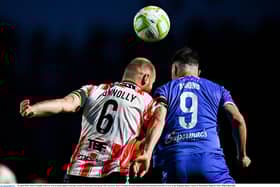 KEY BATTLE . .  Mark Connolly in action against Padraig Amond of Waterford.