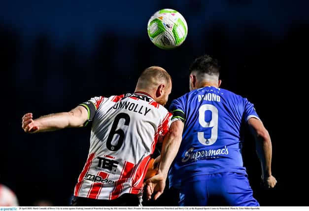 KEY BATTLE . . Mark Connolly in action against Padraig Amond of Waterford.
