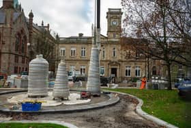 The Factory Girls Sculpture have arrived on site as part of Derry City and Strabane District Councils redevelopment of Harbour Square.. In an operation taking several hours the art work of three spools,  created by Chris Wilson was lowered by crane before being fixed in position. Picture Martin McKeown. 10.12.24