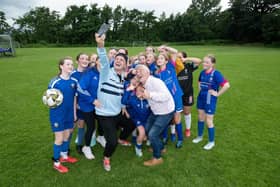 Tadhg Fleming and Derry Fleming with members  from the Buncrana Hearts FC , joined by TikTok sensations Tadhg and Derry Fleming, as they celebrate being awarded €2,000 from Re-turn.