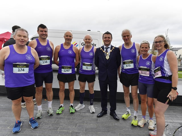 Some of the runners from Foyle Valley AC, who took part in 2025 Waterside Half Marathon, pictured with Mayor Ruairí McHugh . Photo: George Sweeney