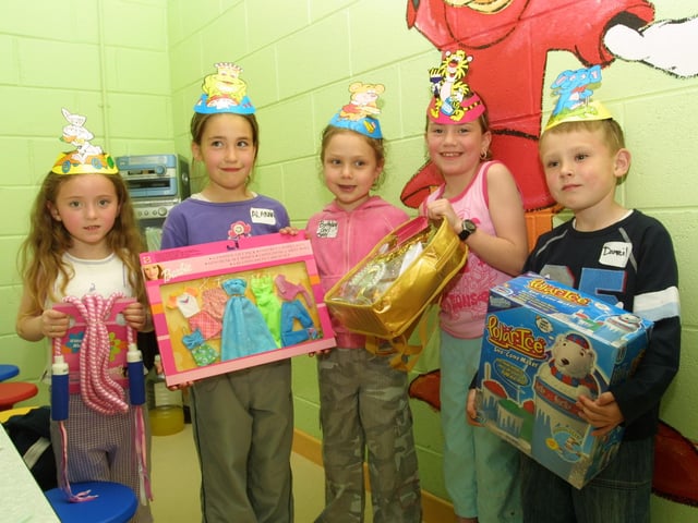 Melissa Rabbett, Alanna Glen, Laura Johnstone and Daniel Glen giving Amy Walsh her birthday presents