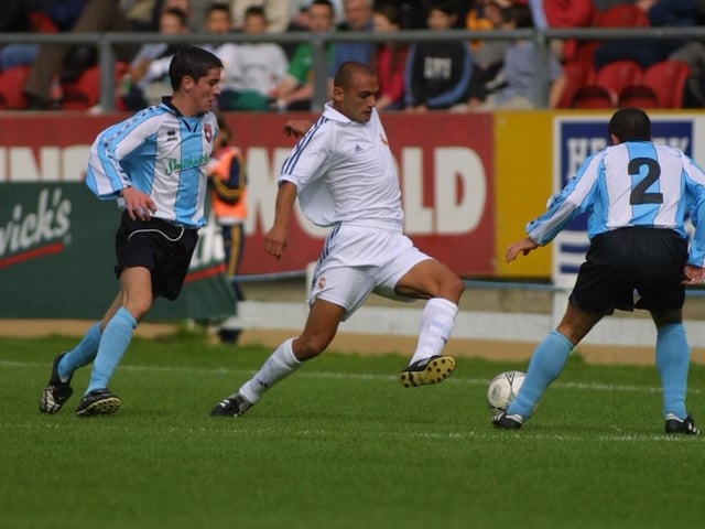 Gareth McGlynn and Eddie McCallion close in on Carlos Aranda