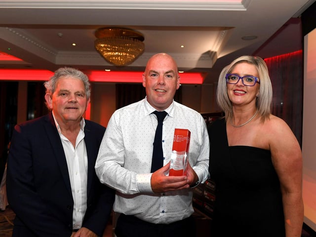 Inspirational Educator of the Year Award winner Sean Curran receives his award from Professor of Inclusive Entrepreneurship Dr Laura Bradley-McCauley, Ulster University and compere Adrian Logan. Photo: George Sweeney