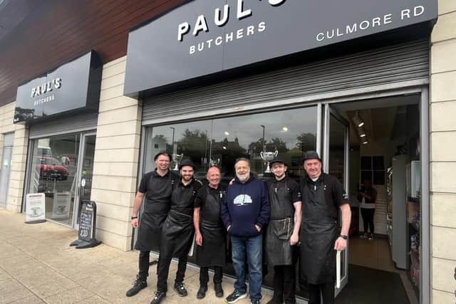 Russell Crowe with staff at Paul's Butchers after he called in for a steak sandwich on Tuesday.