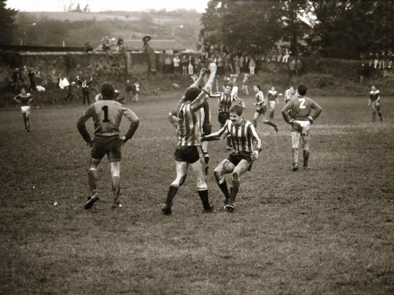 Derry City in action as fans watch on.