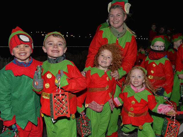 Culmore Community Partnership Elf Parade makes its way towards the Community Hub on Friday night. Photo: George Sweeney