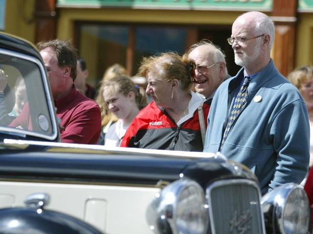 An Austin Six goes past an appreciative crowd during the vintage rally in Moville in 2004. (0607jB24)