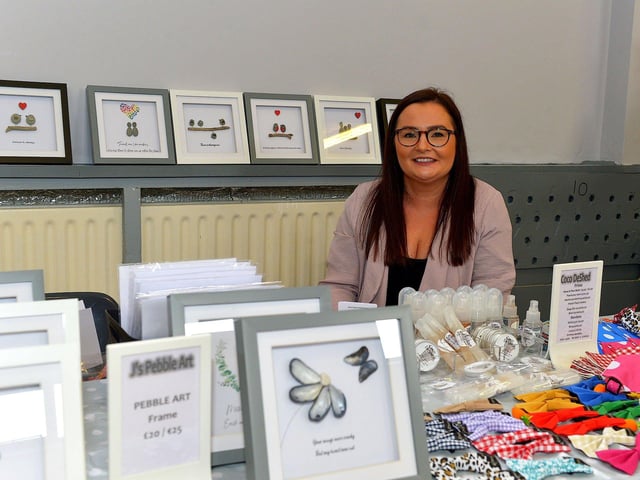 Jade Diver from J's Pebble Art at her stall during the Spring Craft Fair held in St Mary's Hall Muff on Sunday last. Photo: George Sweeney. DER2310GS – 002