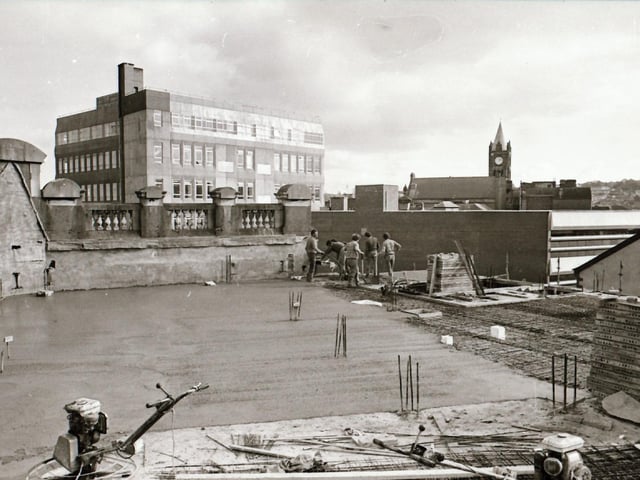 Workers on the roof of the Bank of Ireland building, Derry city centre.