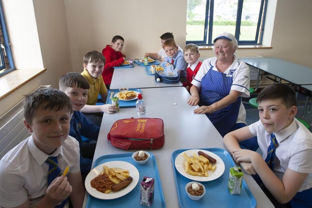 DINNER LADY!. . . . St. Joseph’s Boys School Dinner Lady Lorraine Ferry pictured with some of the. P7 pupils.