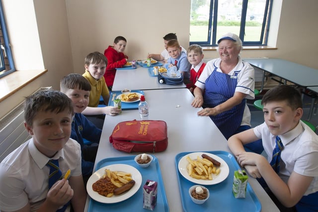 DINNER LADY!.  . . . St. Joseph’s Boys School Dinner Lady Lorraine Ferry pictured with some of the. P7 pupils.