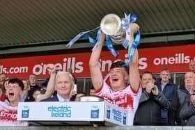 Derry minor captain James Sargent lifts the Fr. Murray Cup after defeating Armagh in Healy Park on Sunday.