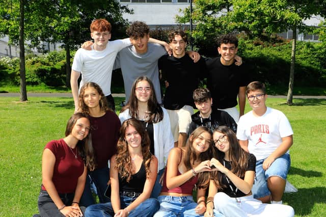 Young Italian teens from the North West Academy of English relaxing in the sunshine at Brooke Park (Photo - Tom Heaney, nwpresspics)