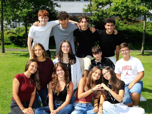Young Italian teens from the North West Academy of English relaxing in the sunshine at Brooke Park (Photo - Tom Heaney, nwpresspics)