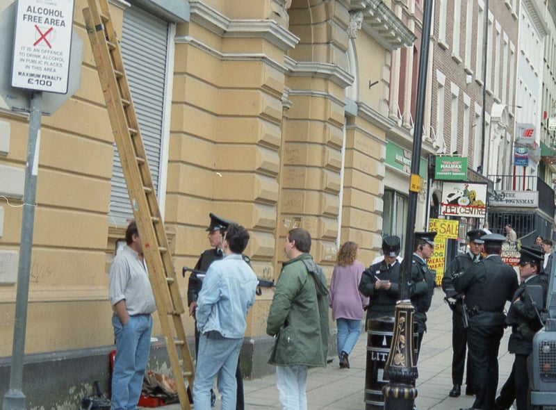 RUC officers quizzing those erecting some of the first street signs in Irish at Shipquay Street in 1992.