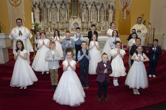 Pupils from Oakgrove Integrated Primary School pictured after receiving the Sacrament of First Holy Communion from Fr. Patrick Lagan at St. Columba’s Church, Waterside on Friday afternoon last. Inlcuded is Deacon Stephen Ward. (Photos: Jim McCafferty Photography)