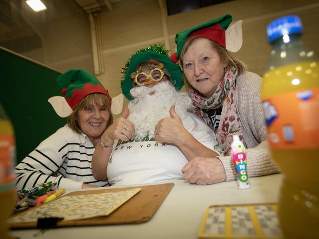 IN THE CHRISTMAS SPIRIT. . . .Doreen Travers, Ann O'Donnell and Lyn O'Connell get into the festive mood at Wednesday's OLT Christmas Bingo. : .