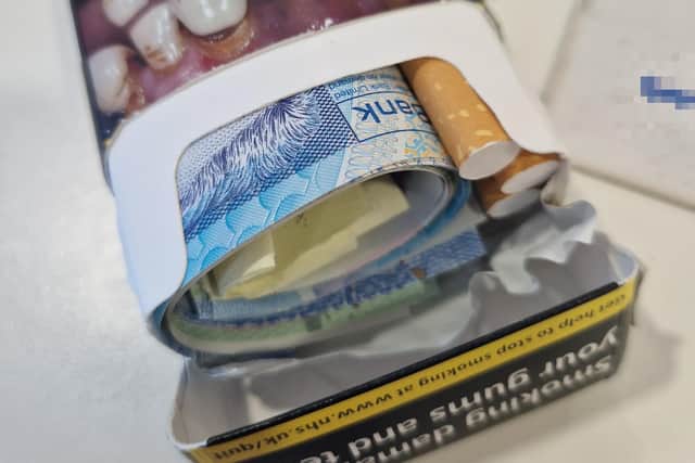 A packet of cigarettes containing £500 and a mobile telephone number that was left in an alleged Mi5 approach on Friday.