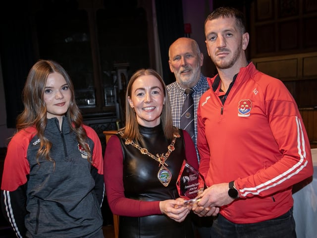 Ryan Gallagher winner of the Community Coach for Cricket award receiving his trophy from the Mayor, Grace Ui Niallais at the Annual Derry City and Strabane District Sports Awards 2026 in the Guildhall on Thursday night. Back centre is Bill Anderson, Chair, Sports Council, and on right his niece Abbie, who nominated him. (Photos: Jim McCafferty Photography)