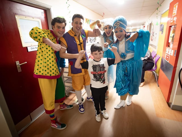 Characters from 'Aladdin' the 2024 Christmas Pantomime at the Millennium Forum who were on a visit to the Children's Ward at Altnagelvin Hospital on Thursday afternoon. They are pictured with 9 years old Logan. (Photos: Jim McCafferty Photography)