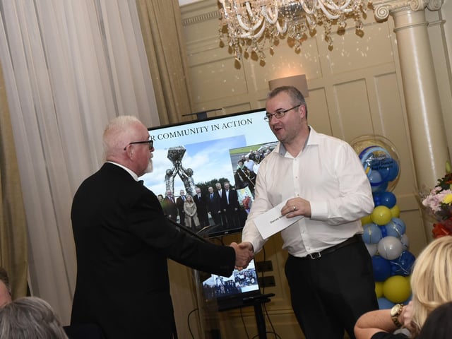 Charlie McDaid, founding member, GSAP making a special presentation to Darren Kirby on Friday night.  : .