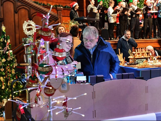 People browse the large range of gifts at the Guildhall Christmas Fair on Friday afternoon. Photo: George Sweeney / Derry Journal