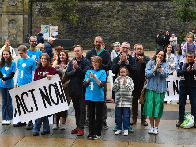 Some of the attendance, in Guildhall Square, at Caleb's Cause rally calling for legal protection for young people with Special Educational Needs who have disabilities in Northern Ireland beyond the age of 19. Photo: George Sweeney
