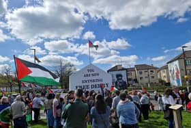 Protest to “Stop arming the genocide.”