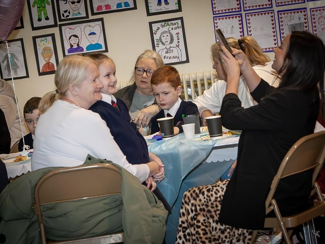 Holy Child PS Principal Mrs. Pat Concannon helping out with the photographer during Grandparents To School Day on Wednesday last. (Photos: Jim McCafferty Photography) : .