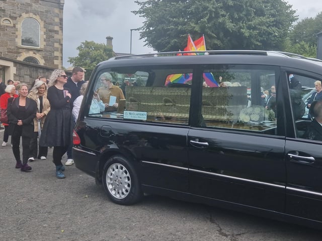 Nell McCafferty's funeral cortege makes it way from the grounds of the Long Tower.