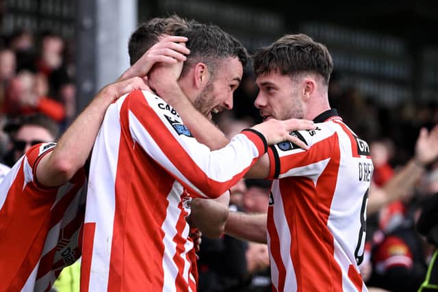 GOOD TIMES . . . Skipper Michael Duffy celebrates with team-mate Adam O'Reilly. Photo by Stephen McCarthy/Sportsfile