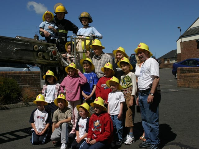 Children from Chernobyl with family and Derry's fire and rescue.
